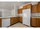 Spacious kitchen with tile floors, light oak cabinets, and modern appliances at 341 Grapevine Rd, Mesquite, NV 89027