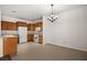 Well-lit kitchen features tile flooring, oak cabinets, and modern appliances at 341 Grapevine Rd, Mesquite, NV 89027