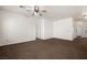 Large living room with carpeted floor and multiple entrances to other rooms in the home at 341 Grapevine Rd, Mesquite, NV 89027