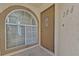 Entryway with an arched window and front door to unit 206 at 3672 Angela Robin St # 206, Las Vegas, NV 89129