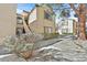 Beautiful condo exterior with well maintained landscaping, sidewalk and shade tree at 3672 Angela Robin St # 206, Las Vegas, NV 89129