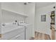 Convenient laundry room with washer, dryer, and overhead shelf for storage at 3672 Angela Robin St # 206, Las Vegas, NV 89129