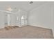 Bright, carpeted living room with an arched window and adjacent doorway at 3672 Angela Robin St # 206, Las Vegas, NV 89129