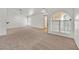 Spacious carpeted living room featuring high ceilings and ample natural light at 3672 Angela Robin St # 206, Las Vegas, NV 89129