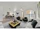Living room with modern decor and large windows, virtually staged at 3672 Angela Robin St # 206, Las Vegas, NV 89129