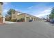 Row of garages and parking spaces, with tidy landscaping, in this well-kept community at 3672 Angela Robin St # 206, Las Vegas, NV 89129