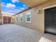 Backyard patio with brick floor and view of rear entrance at 380 Baratheon Ave, Las Vegas, NV 89183