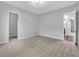 A neutral bedroom featuring an ensuite bathroom and walk-in closet at 380 Baratheon Ave, Las Vegas, NV 89183
