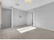 Spacious bonus room with neutral carpeting, recessed lighting, and a view of the stairway at 380 Baratheon Ave, Las Vegas, NV 89183