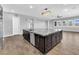 Gourmet kitchen island with granite countertops, stainless steel dishwasher and breakfast bar seating at 380 Baratheon Ave, Las Vegas, NV 89183