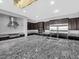 A large kitchen featuring granite counters, a stainless range hood, and an island with seating at 380 Baratheon Ave, Las Vegas, NV 89183