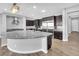 Open concept kitchen with stainless steel appliances, granite counters, and large island at 380 Baratheon Ave, Las Vegas, NV 89183