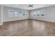 Bright living area with tile flooring, multiple windows, and neutral color scheme at 380 Baratheon Ave, Las Vegas, NV 89183