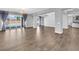 Spacious living room features tile flooring, large sliding glass doors, and modern lighting at 380 Baratheon Ave, Las Vegas, NV 89183