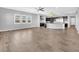 Open concept living room featuring tile floors, modern fixtures, and ample natural light at 380 Baratheon Ave, Las Vegas, NV 89183