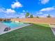 Backyard pool with turf and brick privacy wall provides space for relaxing at 380 Baratheon Ave, Las Vegas, NV 89183