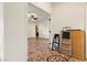 View into a bonus room with light walls and tile floors from an adjoining room at 3823 Chapels Royal St, Laughlin, NV 89029