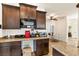 Kitchen showcasing granite counters, dark cabinetry, and stainless steel microwave at 3823 Chapels Royal St, Laughlin, NV 89029