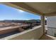 Balcony showcasing the desert surroundings and community homes, framed by a clear blue sky and warm sunlight at 3921 Painted Lady Ave, Las Vegas, NV 89141