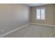 Neutral bedroom with carpet flooring and window with shutters at 3921 Painted Lady Ave, Las Vegas, NV 89141