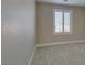 Neutral bedroom with carpet flooring and window with shutters at 3921 Painted Lady Ave, Las Vegas, NV 89141