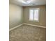 Neutral bedroom with carpet flooring, fan and window with shutters at 3921 Painted Lady Ave, Las Vegas, NV 89141