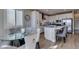 Dining area showing open layout to the kitchen, adjacent dining, and sliding glass door to the patio at 3921 Painted Lady Ave, Las Vegas, NV 89141