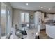 Bright dining area with glass table set, kitchen access, and sliding door to the backyard at 3921 Painted Lady Ave, Las Vegas, NV 89141