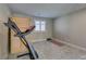 Exercise room with carpet flooring, fitness equipment, and a shuttered window at 3921 Painted Lady Ave, Las Vegas, NV 89141