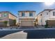 Charming two-story home boasting a well-manicured front yard, a two-car garage, and appealing architectural details at 3921 Painted Lady Ave, Las Vegas, NV 89141