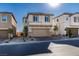 Attractive two-story home featuring a two-car garage, charming landscape, and inviting curb appeal at 3921 Painted Lady Ave, Las Vegas, NV 89141