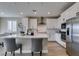 Bright kitchen with stainless steel appliances and a large center island with seating at 3921 Painted Lady Ave, Las Vegas, NV 89141