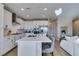 Bright kitchen features white cabinets, stainless steel appliances, and a large center island with seating at 3921 Painted Lady Ave, Las Vegas, NV 89141