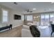 Spacious living area with a plush sectional, stylish lighting, and seamless flow to the outdoor patio at 3921 Painted Lady Ave, Las Vegas, NV 89141