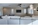 Spacious living area with a plush sectional, stylish lighting, and media setup, perfect for relaxation and entertainment at 3921 Painted Lady Ave, Las Vegas, NV 89141