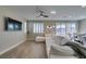 Inviting living space with a comfortable sectional sofa, modern decor, and seamless transition to the dining area at 3921 Painted Lady Ave, Las Vegas, NV 89141