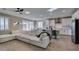 Open living area featuring a large sectional sofa, modern lighting, and seamless access to the contemporary kitchen at 3921 Painted Lady Ave, Las Vegas, NV 89141