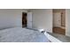 Neutral-toned main bedroom showcasing an open doorway, modern carpet, and views into a spacious walk-in closet at 3921 Painted Lady Ave, Las Vegas, NV 89141