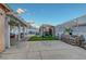 Spacious backyard featuring a covered patio, manicured artificial turf, and a decorative gazebo at 4055 Planetary Ln, Las Vegas, NV 89115