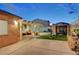 Inviting backyard with covered patio, lounge area, and outdoor seating, perfect for relaxation and entertainment at 4055 Planetary Ln, Las Vegas, NV 89115