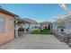 Wide backyard view with covered patio, artificial turf, and backyard gazebo at 4055 Planetary Ln, Las Vegas, NV 89115