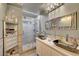 Modern bathroom with double vanity, framed mirror, and glass shower at 4055 Planetary Ln, Las Vegas, NV 89115