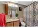Full bathroom featuring modern vanity, mirror, and a patterned shower curtain at 4055 Planetary Ln, Las Vegas, NV 89115