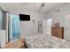 A cozy bedroom with hardwood floors and a television at 4055 Planetary Ln, Las Vegas, NV 89115