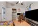 Bright bedroom with desk, computer, and large television at 4055 Planetary Ln, Las Vegas, NV 89115