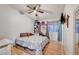 Bright bedroom featuring a ceiling fan, hardwood floors, and ample space at 4055 Planetary Ln, Las Vegas, NV 89115