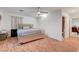 Bedroom with hard wood floors, a bed with a silver frame, and natural light at 4055 Planetary Ln, Las Vegas, NV 89115