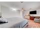 Bedroom with hardwood floors, ceiling fan, and seating area at 4055 Planetary Ln, Las Vegas, NV 89115
