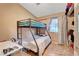 Bedroom featuring a bunk bed and a window for natural light at 4055 Planetary Ln, Las Vegas, NV 89115