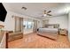 Spacious main bedroom with wood-look flooring and large window at 4055 Planetary Ln, Las Vegas, NV 89115